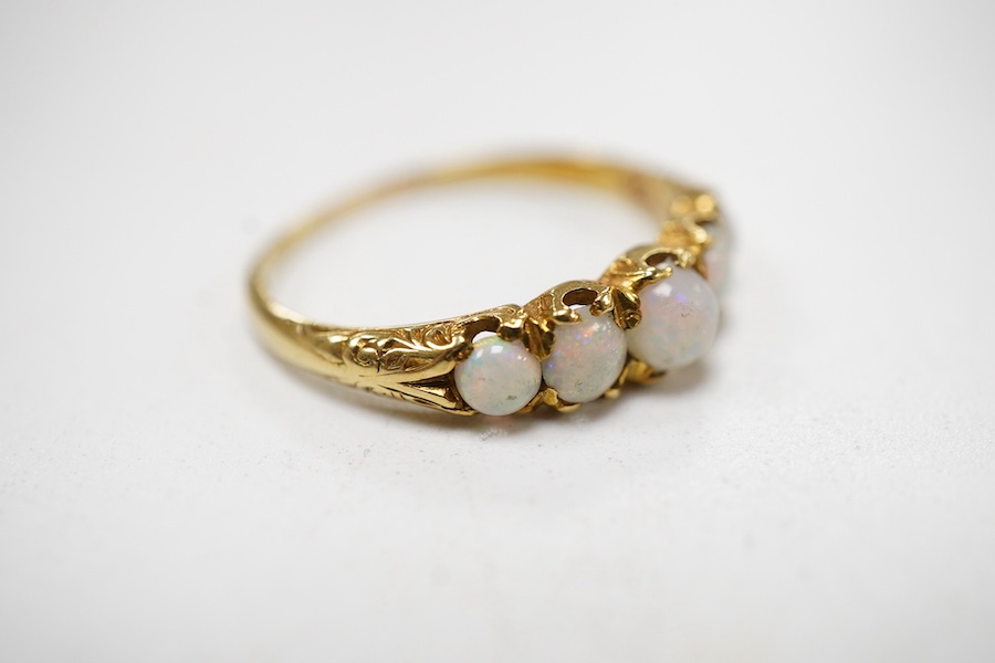 A late Victorian yellow metal and five stone graduated white opal set half hoop ring, the inner shank engraved 'Bran? Ap 4.89', size L.